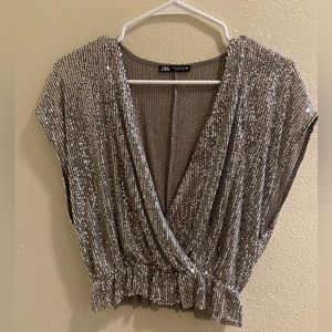 A silver glitter top from zara